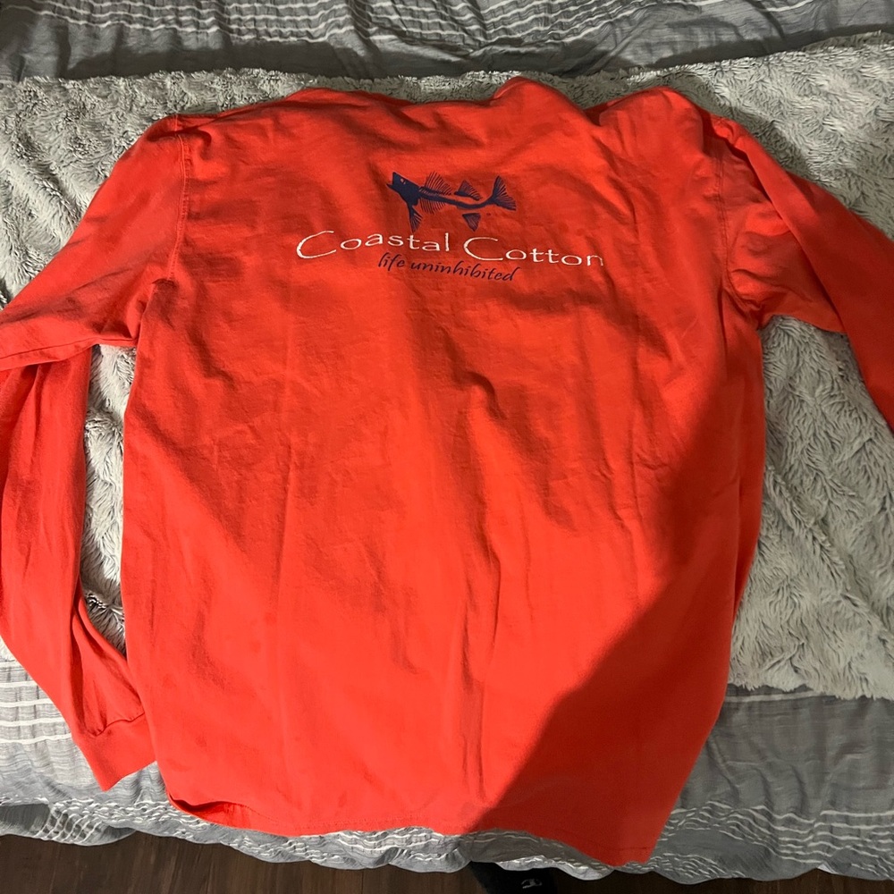 selling a long sleeve bright orange large coastal cotten shirt.